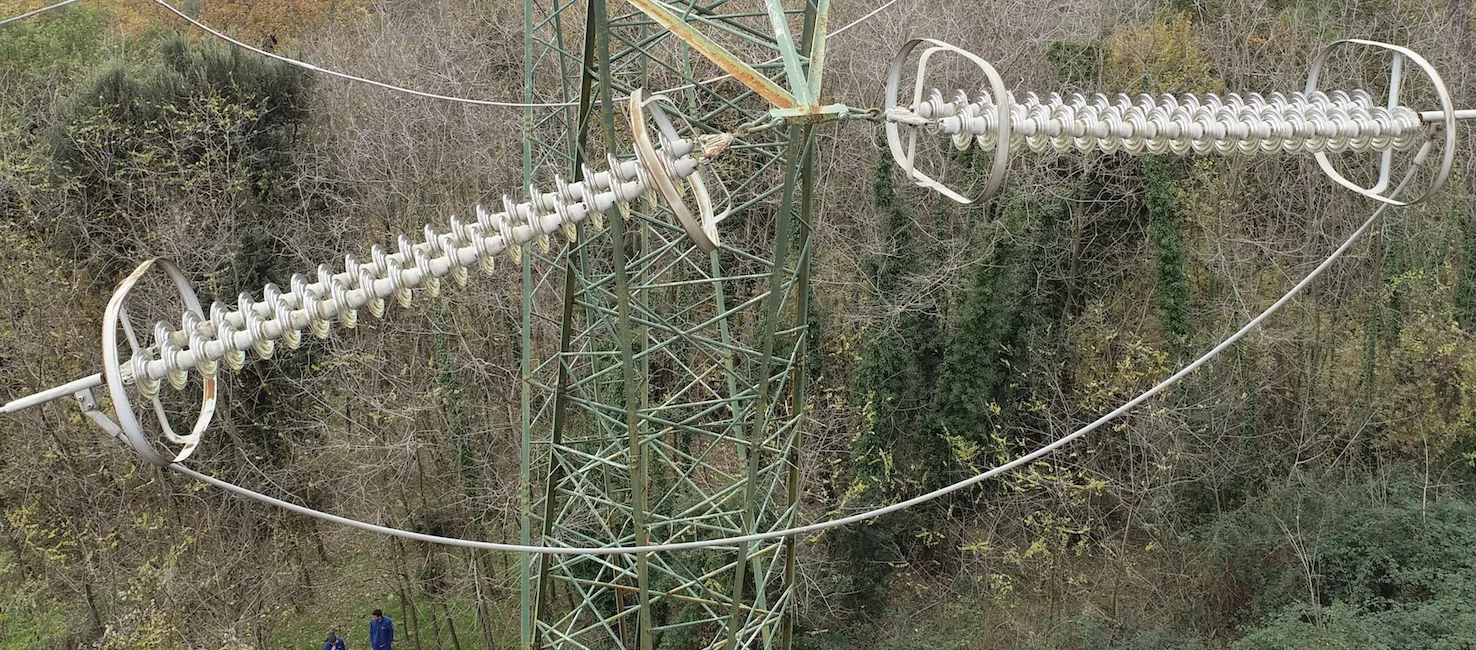 Close-up of power line insulators taken by drone