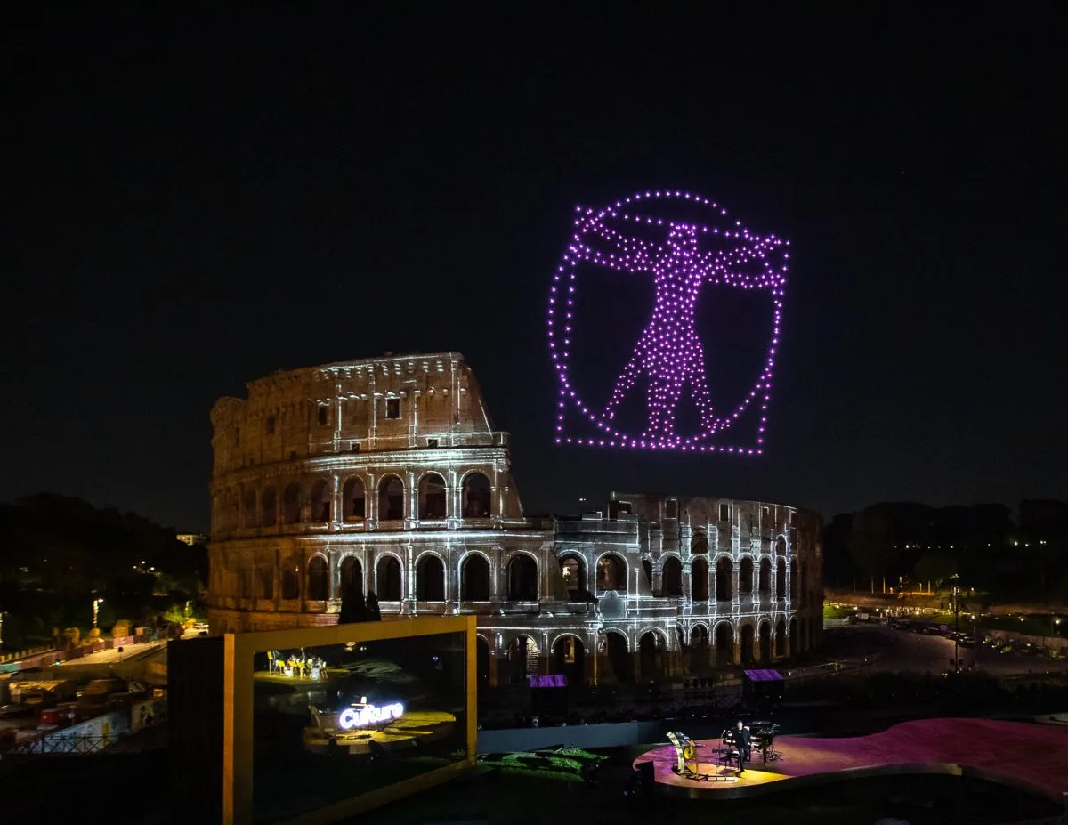 Drones drawing a figure above an ancient monument